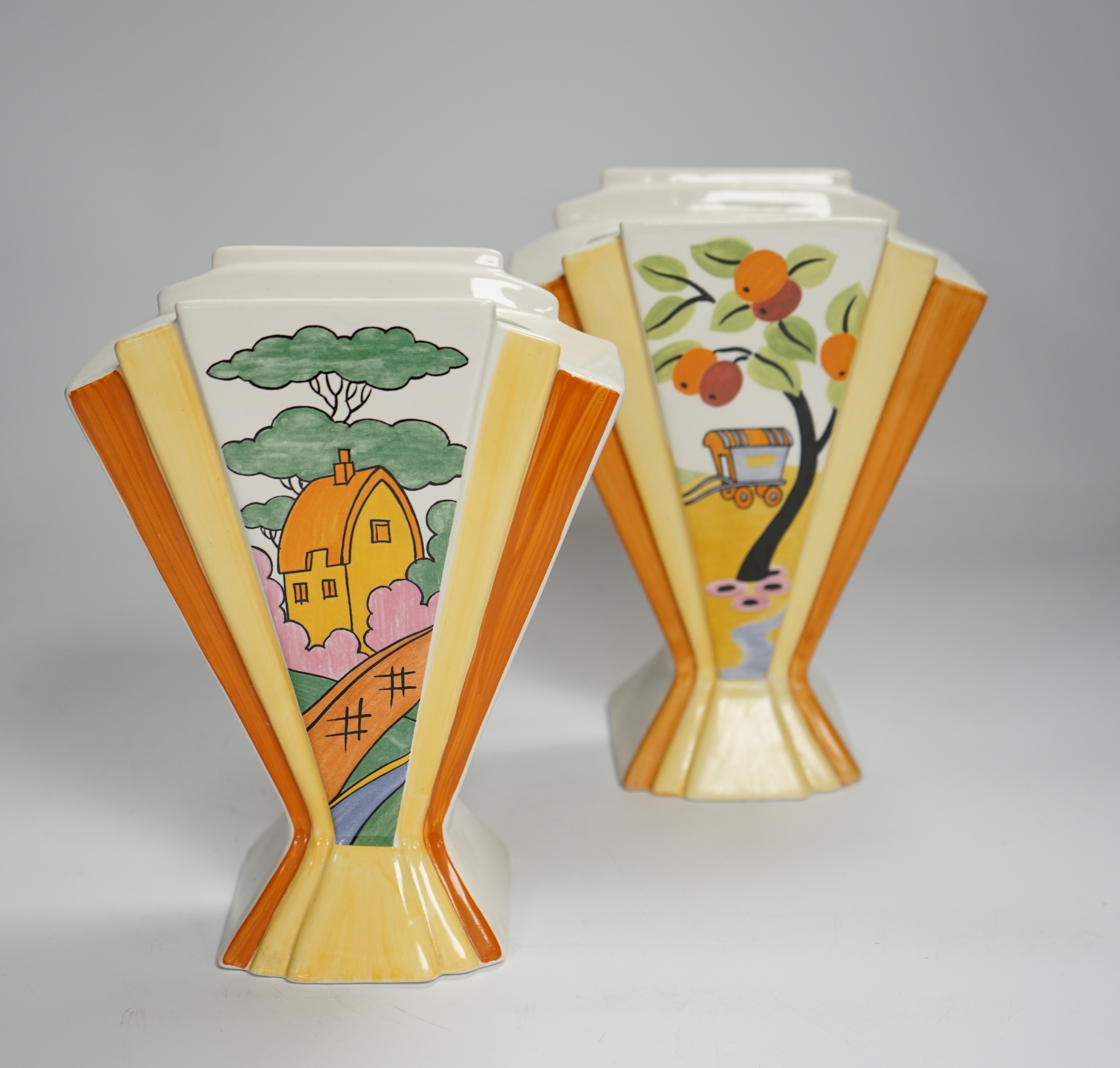 Two modern copies of Clarice Cliff Sunray vases; Caravan and Orange Roof Cottage, 21cm